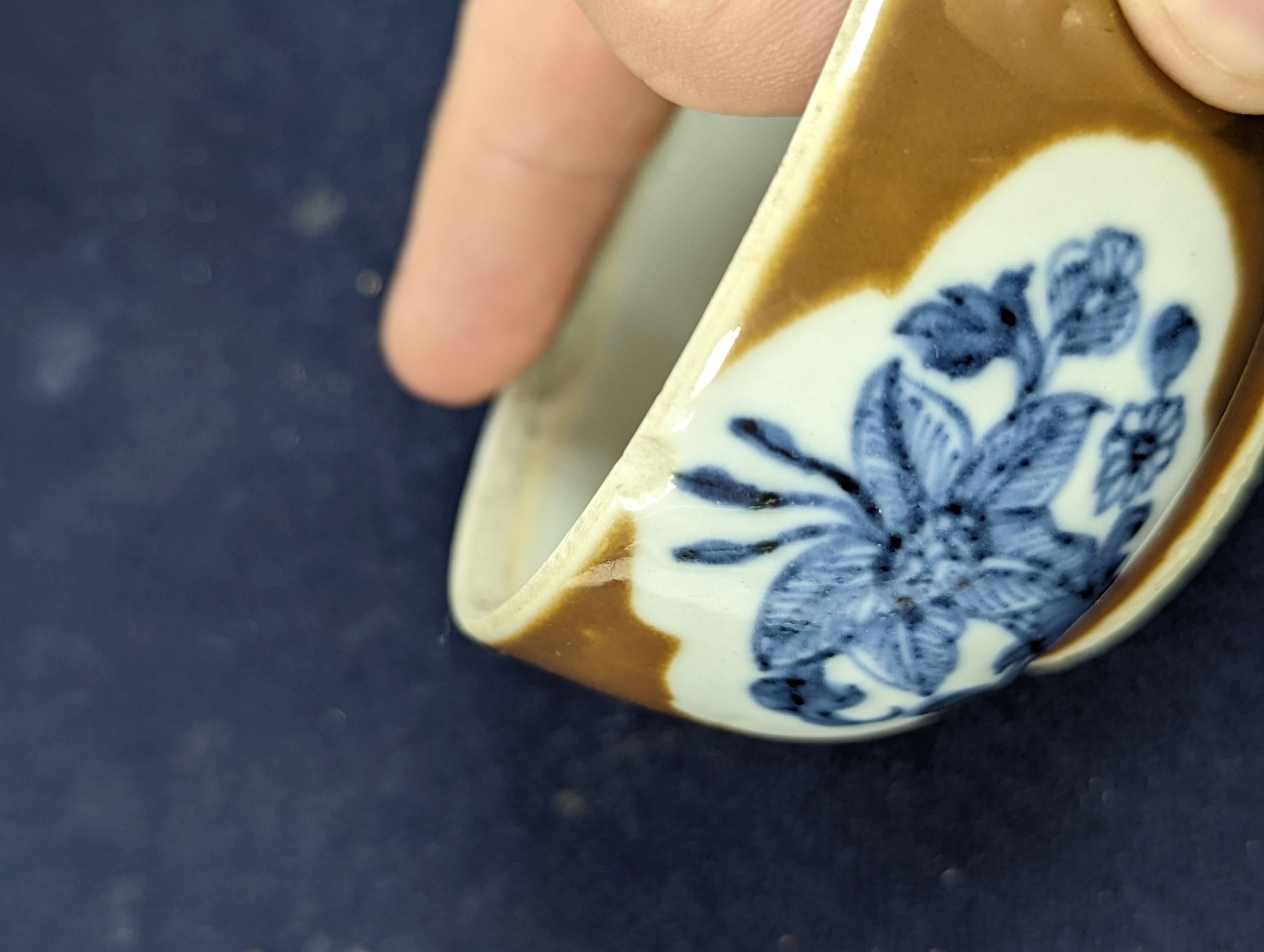 A Chinese cafe au lait glazed saucer, three bowls and a stem cup